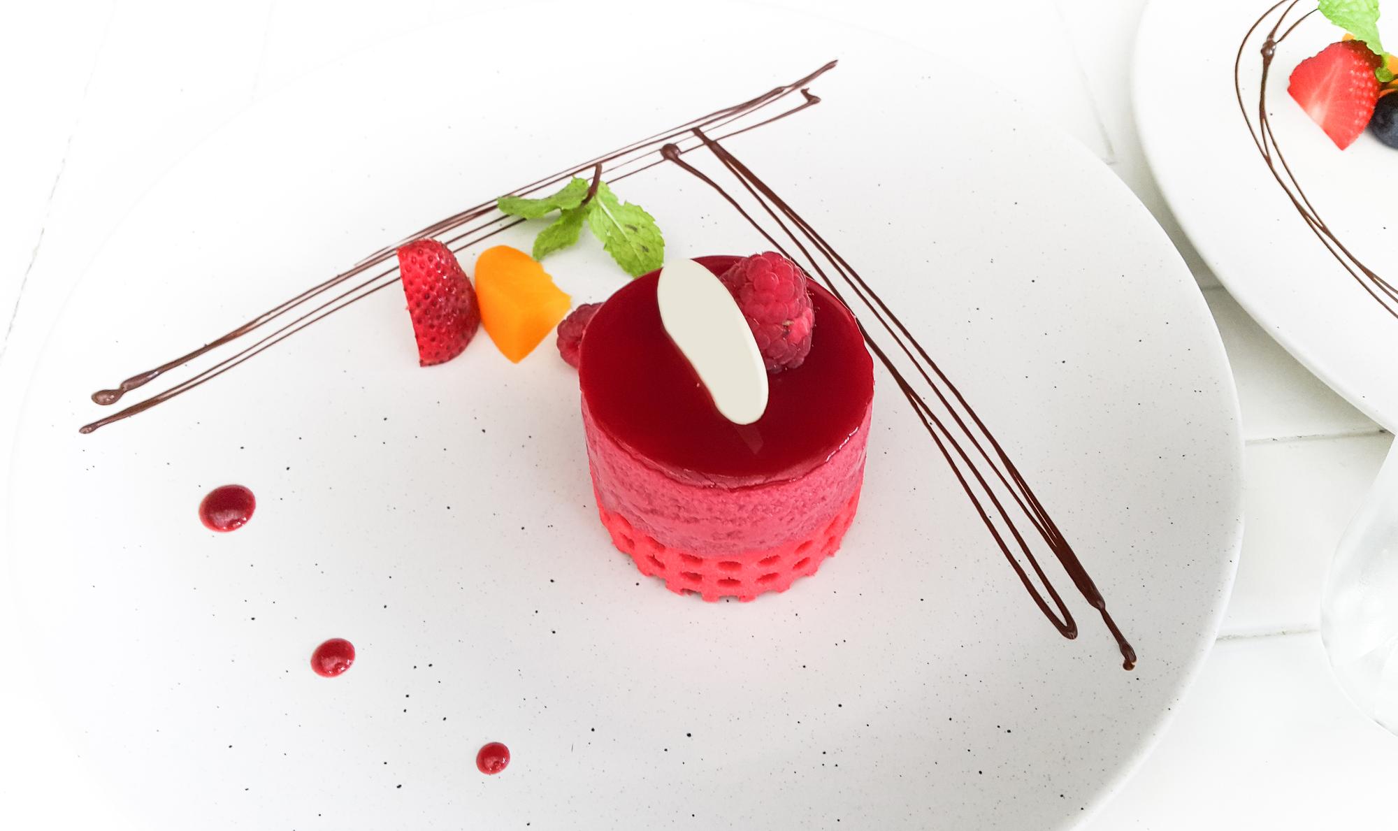 Delicate plated dessert with molecular garnish